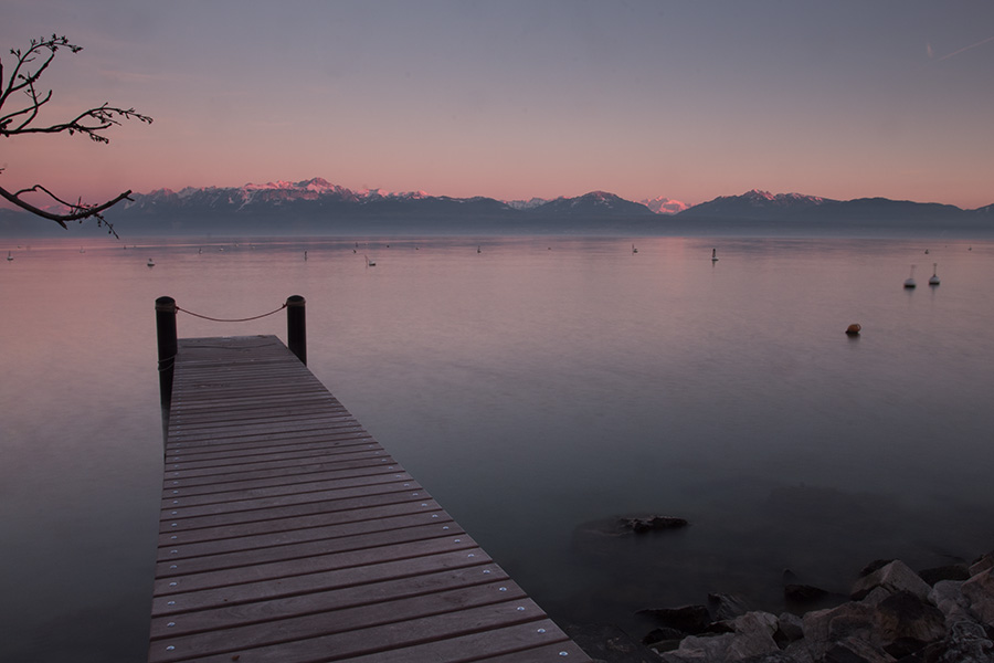 A boat dock with Mt Blanc visible from Morges Switzerland